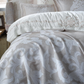 Jacquard, bronze  color bedspread and white duvet cover adorned with baroque design embroideries