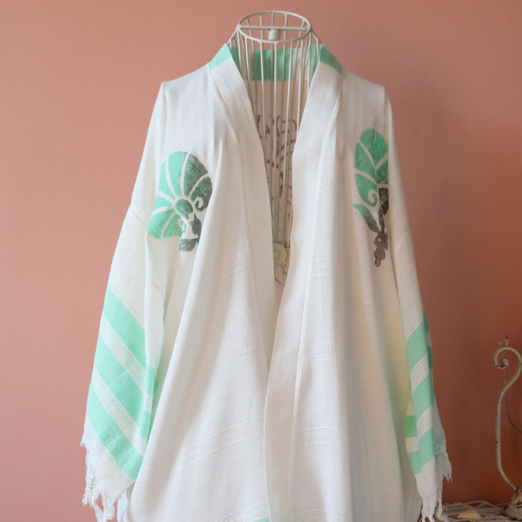 Cotton-bamboo beach dress decorated with green flower designs and stripes