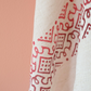 Ecru linen shawl has red, organic dyed prints