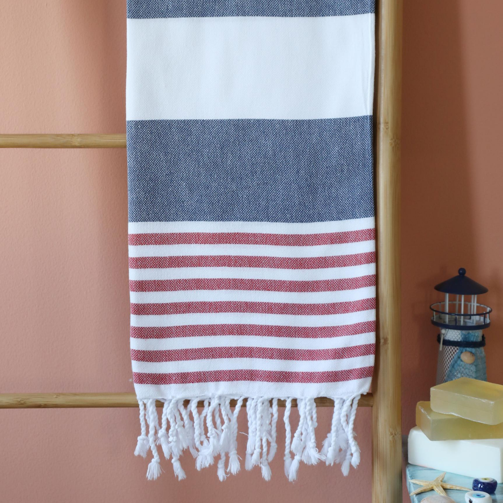 Turkish yacht towel has red and navy stripes and tassels