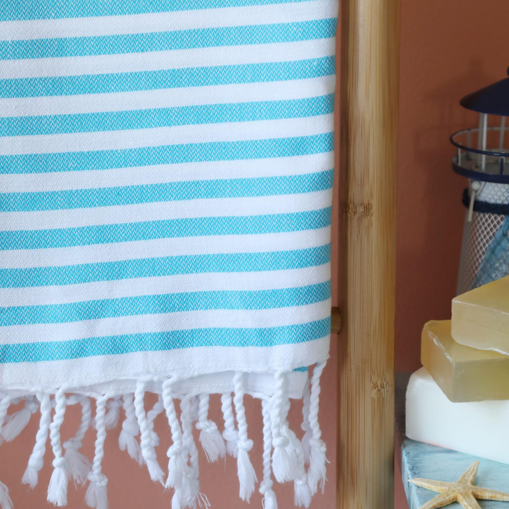 Light-weight Turkish beach towel has blue stripes 