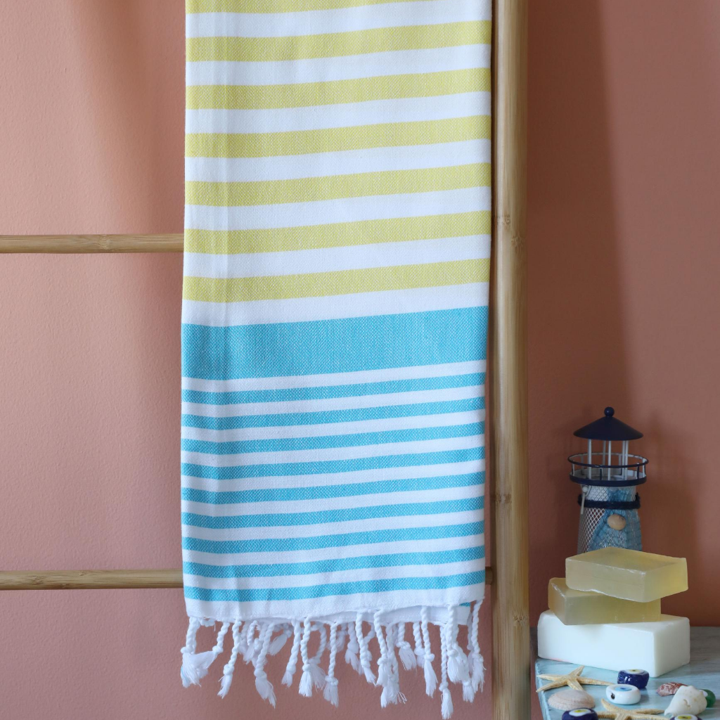 sailor peshtemal towel has blue and yellow stripes on it